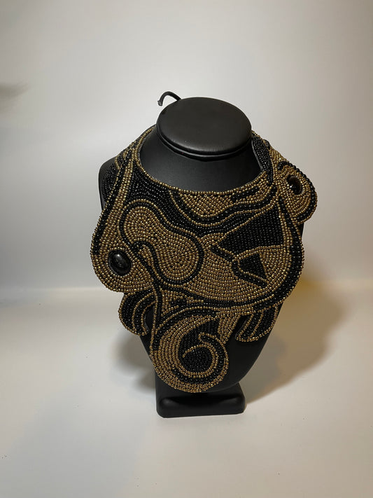 Leather Backed Black and Gold Bead Swirl Bib Necklace