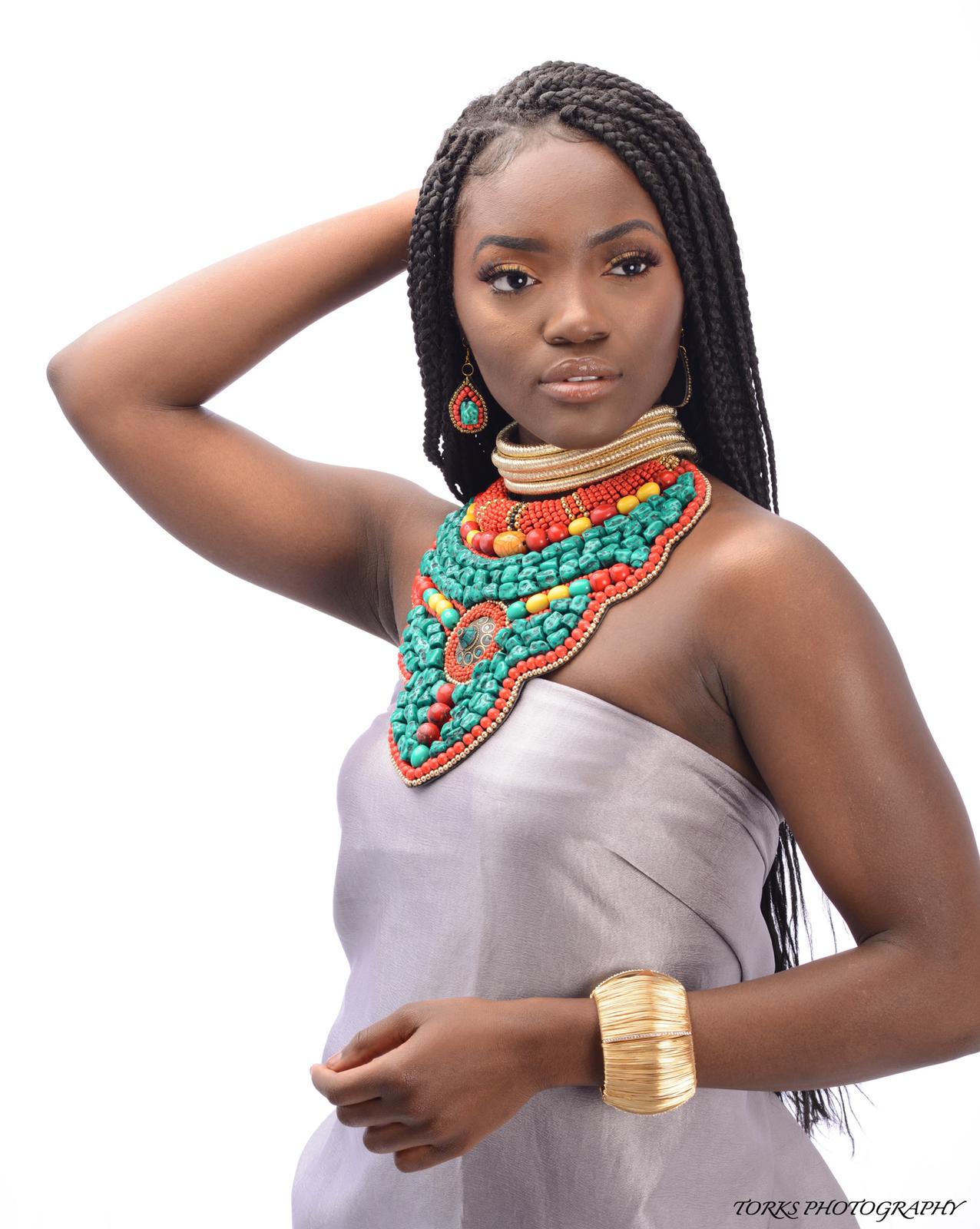 african model with turquoise collar necklace