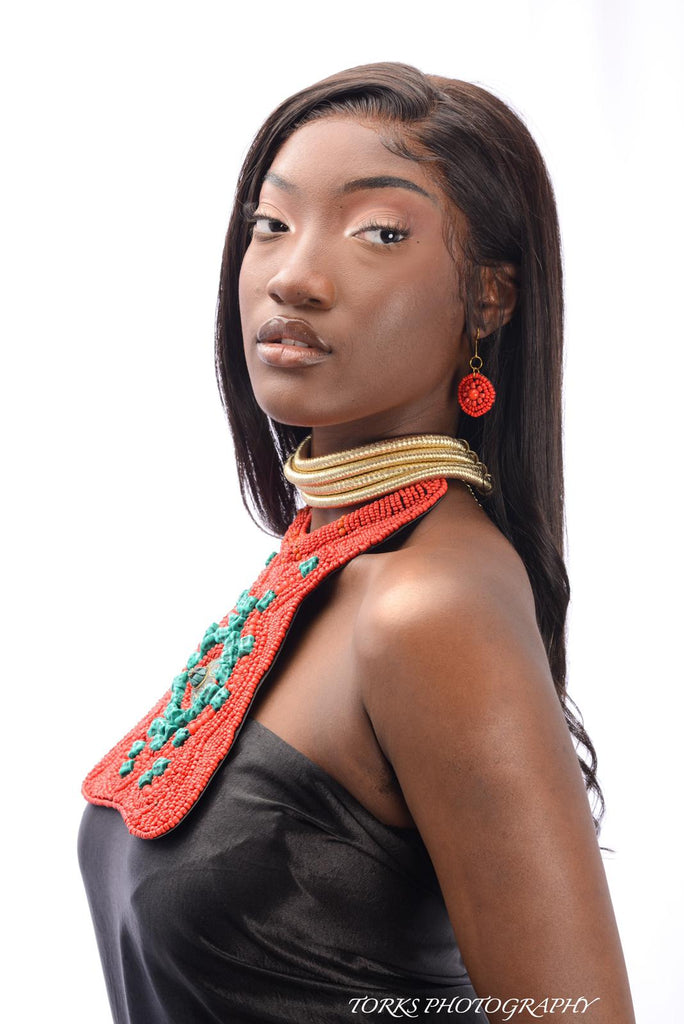 african woman with red and turquoise bead collar