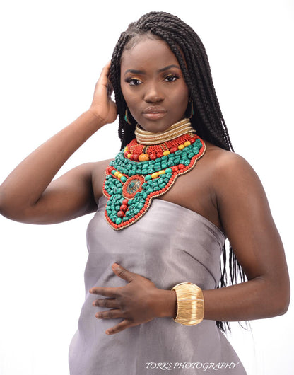 black model with turquoise collar necklace