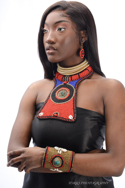 african model with colorful raised bead collar and cowrie shells  