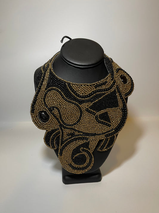 Leather Backed Black and Gold Bead Swirl Bib Necklace