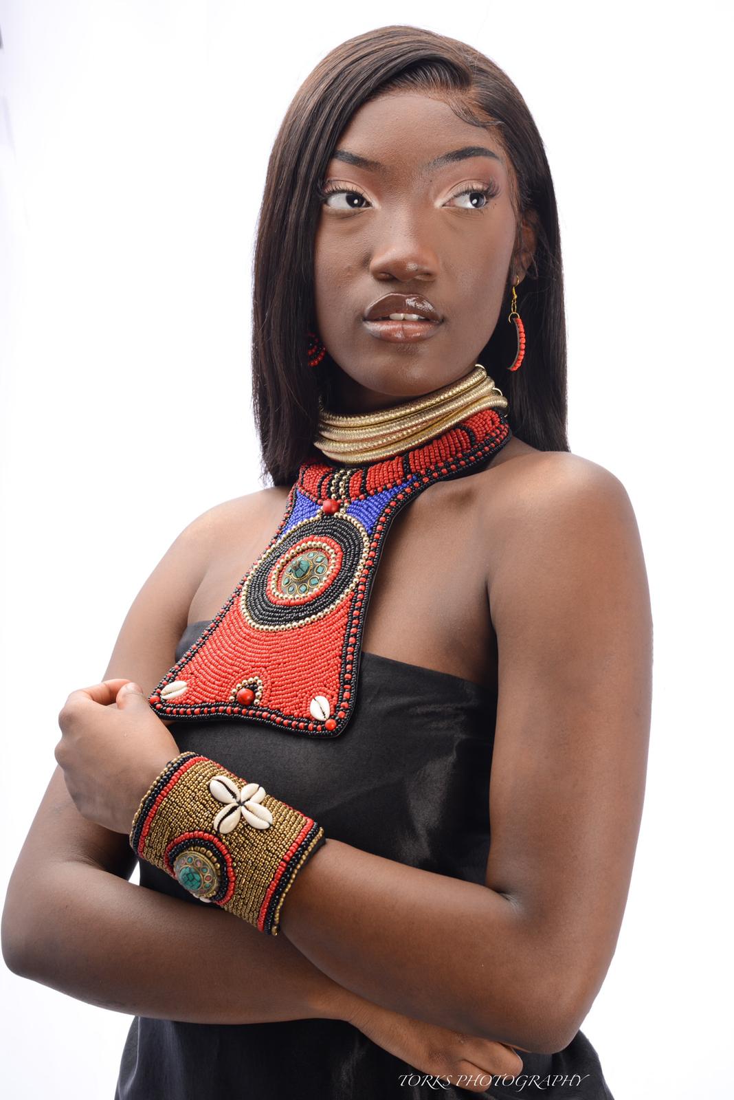 african model with colorful rasied bib necklace and matching bracelet