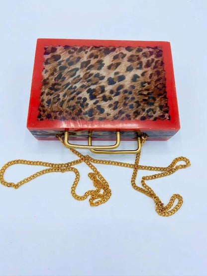 Handcrafted Resin Clutch With Metal Grab Handle.